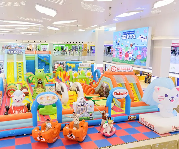 Children playing on a colorful inflatable structure