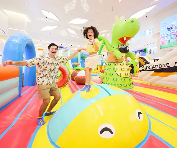 Group of children navigating an inflatable obstacle course