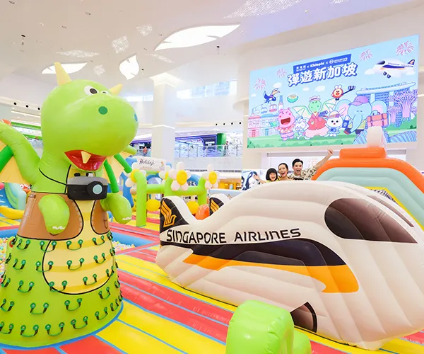 Kids exploring a colorful inflatable tunnel
