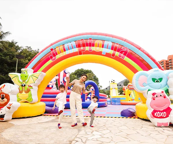 Children having fun on an inflatable slide at Jumptopia