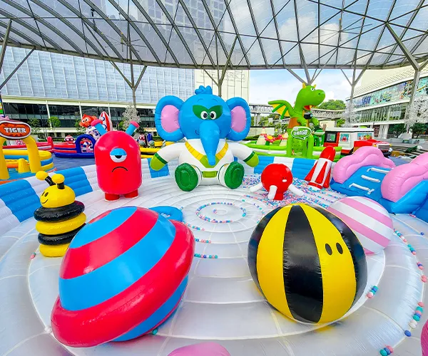 Group of kids on a colourful bouncy obstacle course