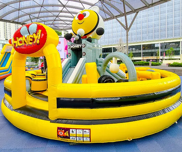 Parent and child having fun on a large inflatable structure